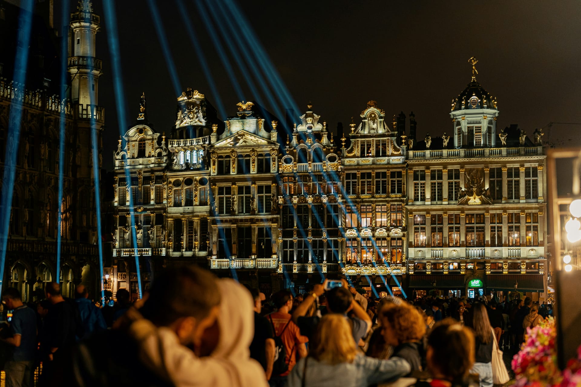 Brussels Grand Place at twilight with illuminated 17th-century guild houses and the Town Hall tower