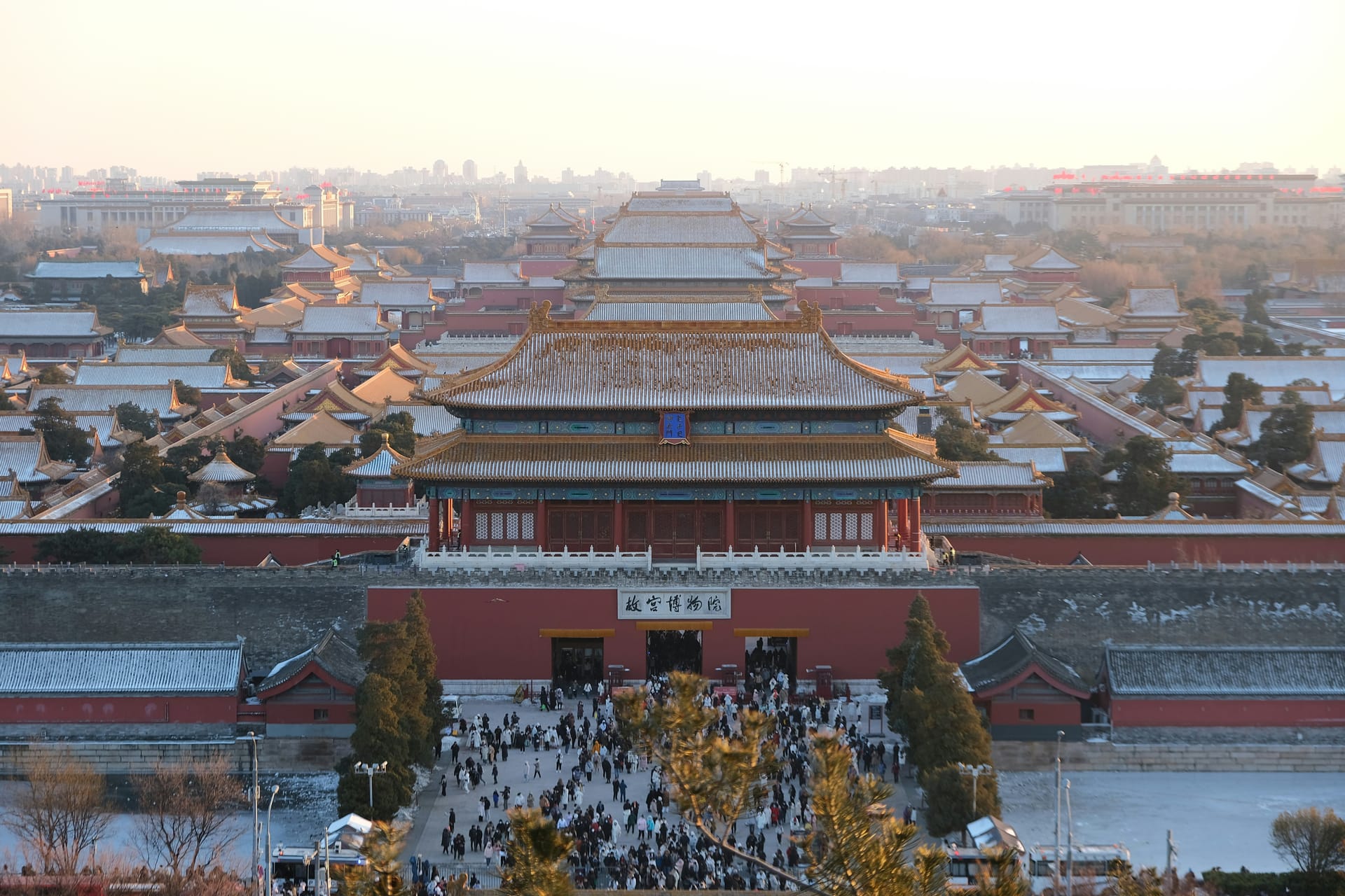 The Forbidden City in Beijing seen from above with golden roofs of multiple imperial halls