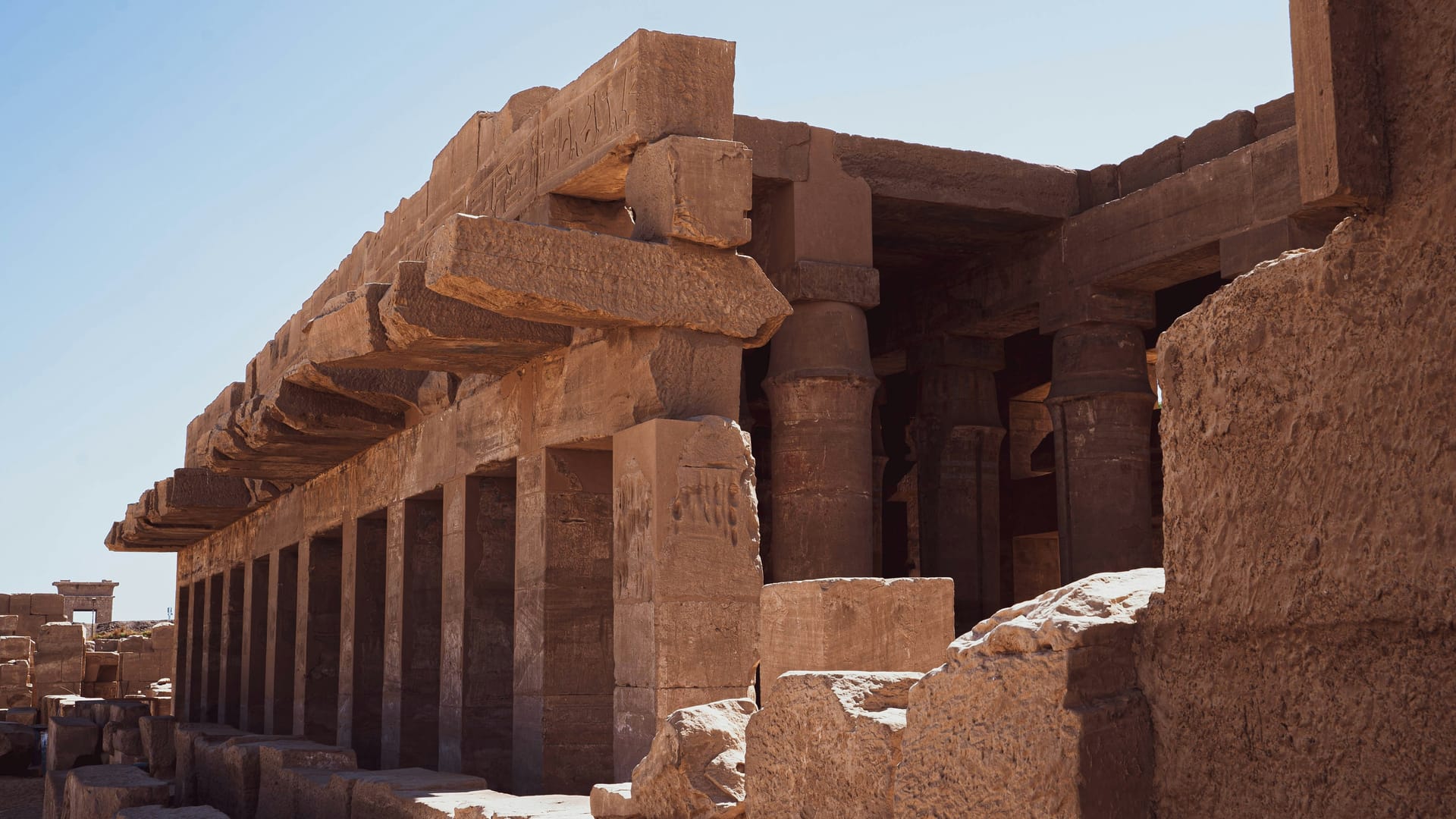 The hypostyle hall at Karnak Temple in Luxor with massive sandstone columns reaching 23 metres high and carved hieroglyphs